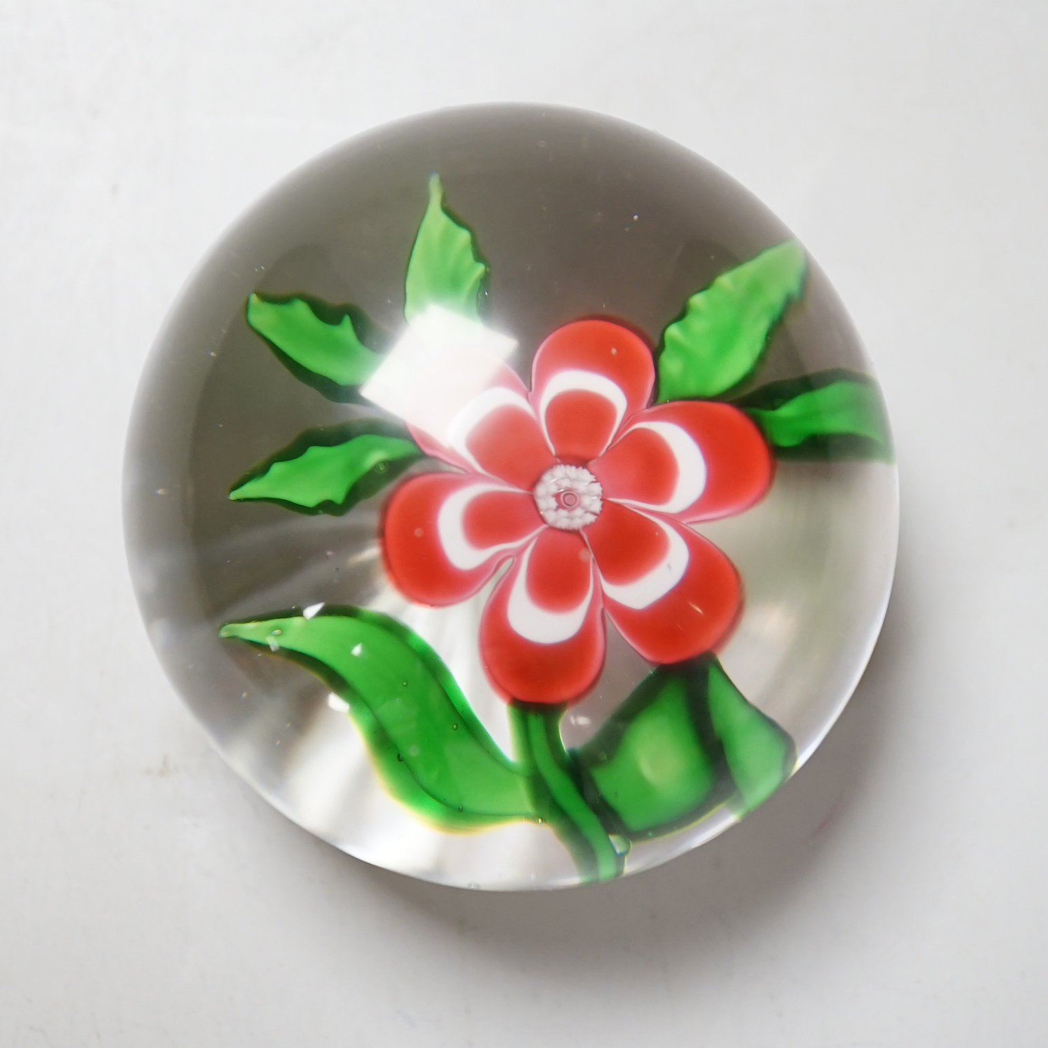 A Baccarat primrose paperweight, approximately 5cm diameter